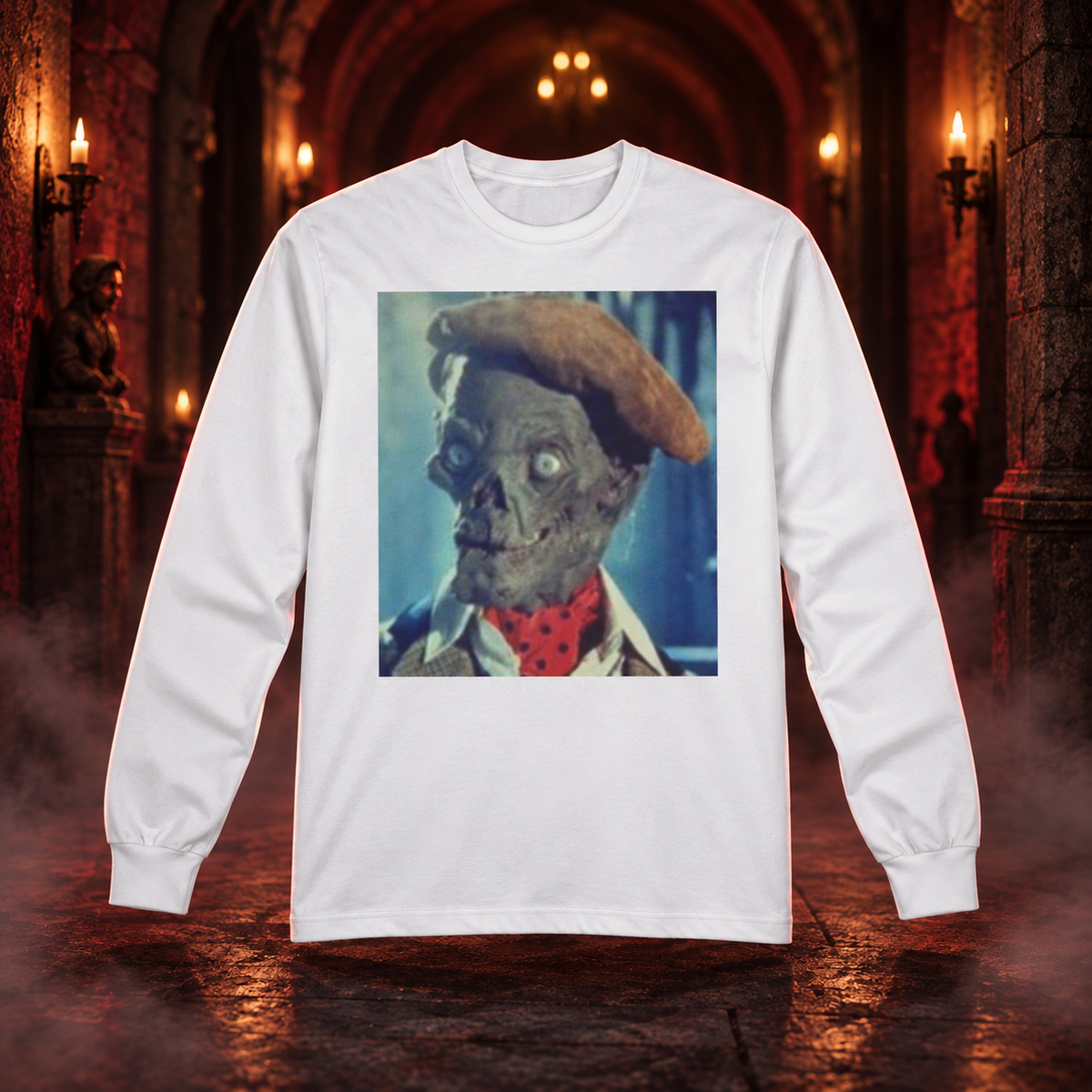 The OG white horror long sleeve tee with a vintage crypt ghoul portrait in a candlelit stone corridor